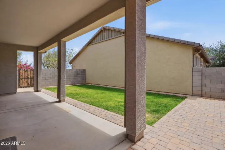 Backyard and extended covered patio, extended pavers, real grass, sprinkler system