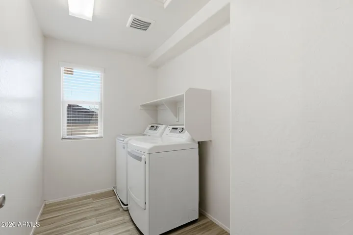 Upstairs Laundry with additional space for work/prep or storage