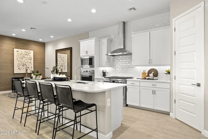 "Disclaimer: The images shown are for illustrative purposes only and depict a similar home design from a previous project. Actual features, finishes, and colors may vary in the new construction. Please consult with our team for specific details regarding this home."