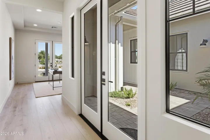 HALL TO OFFICE/GLASS FRENCH DOORS TO COURTYARD