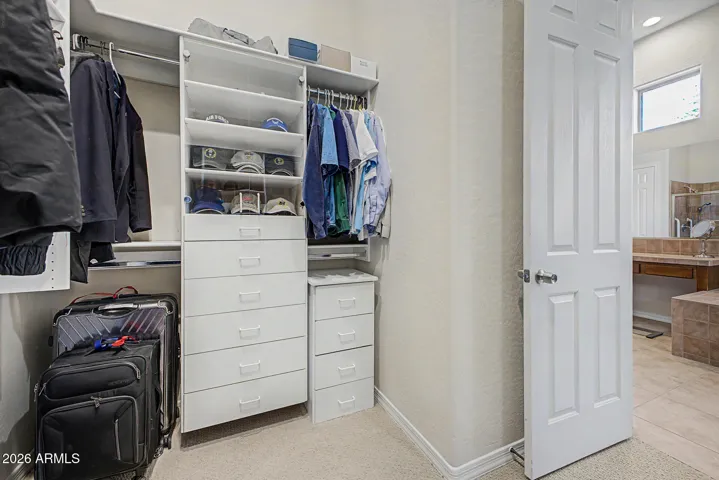 Master closet has shelves and drawers