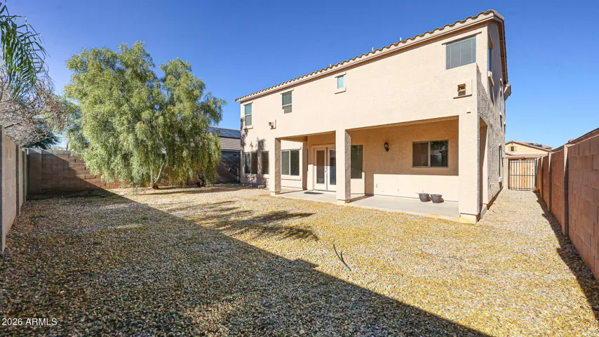 The large, fenced backyard is a blank canvas for you to make your vision become a reality.