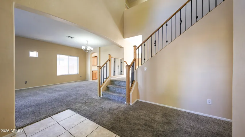 Upon entering the home, you are greeted with a two story entry opening to the living and dining area.