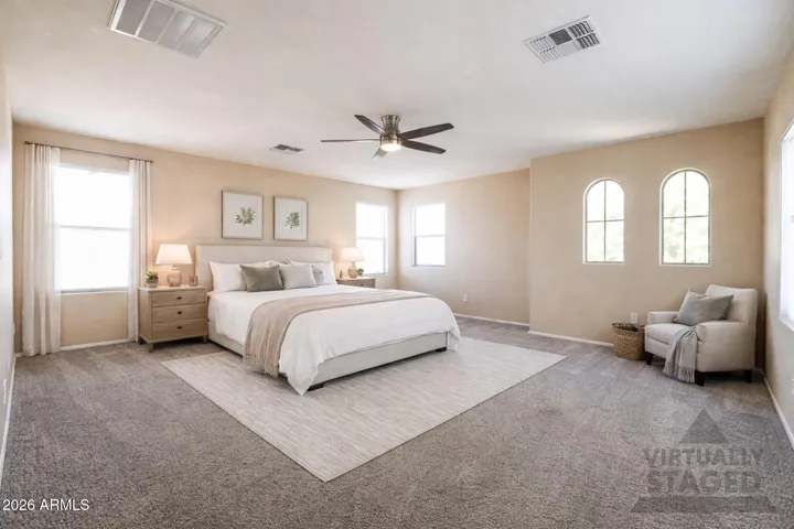 Separated from the other bedrooms is the primary suite.