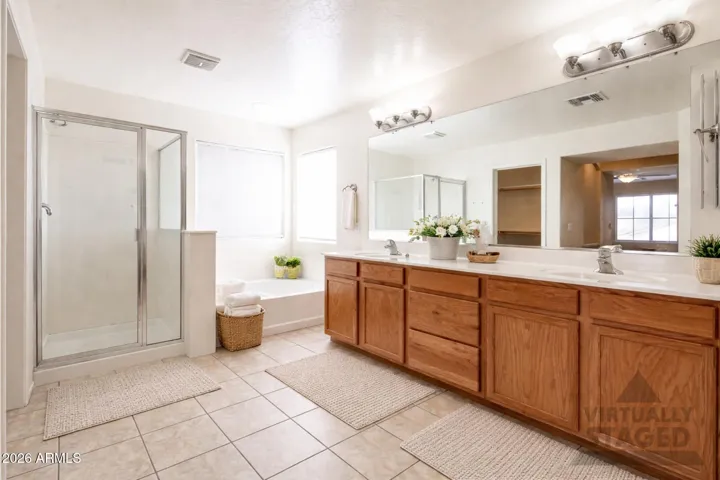 The primary suite features a 5 piece bath with dual walk-in closests.