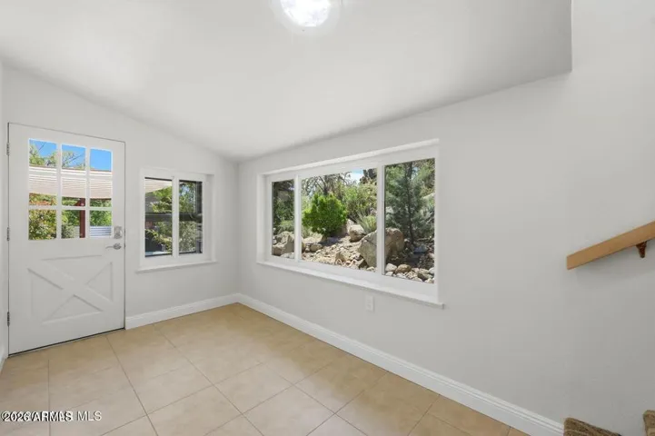 This sunroom can be a studio, office, exercise space. the window has a custom catio.