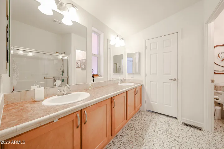Master sinks and penny tile floor