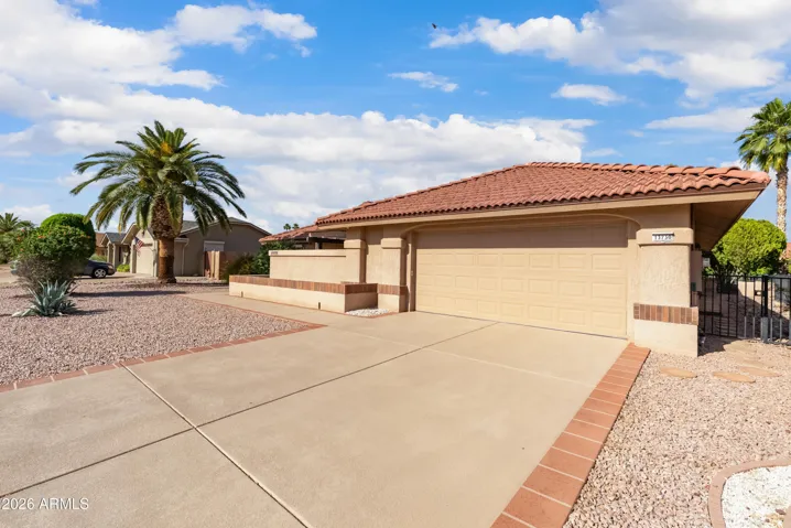 concrete resurfacing with neutral color on garage floor, driveway, sidewalk to porch, front porch and courtyard