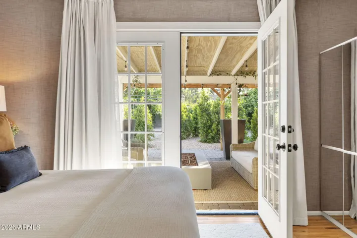 Primary bedroom French doors to back patio