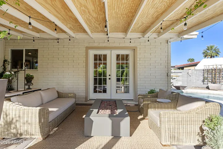 Primary bedroom french doors to back patio