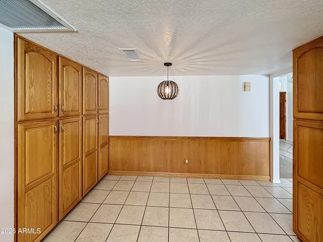 Kitchen eating area with extra cabinets.
