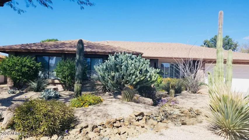 Stunning desert front on this block ranch with newer roof