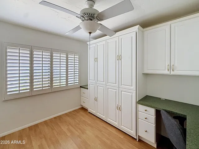 Fourth bedroom office with a Murphy bed and desk built-in