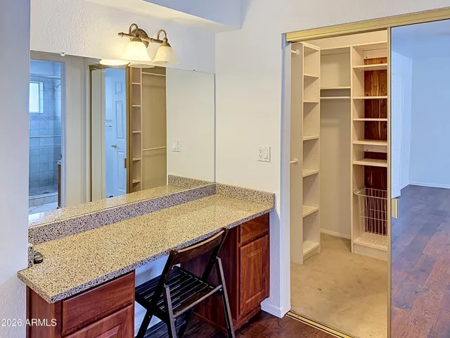 Extra vanity area in primary next to walk-in closet