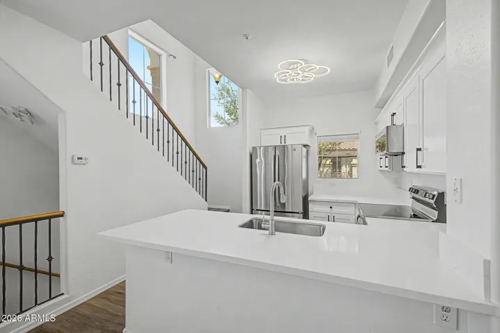Modern kitchen with stainless steel appliances and a kitchen peninsula
