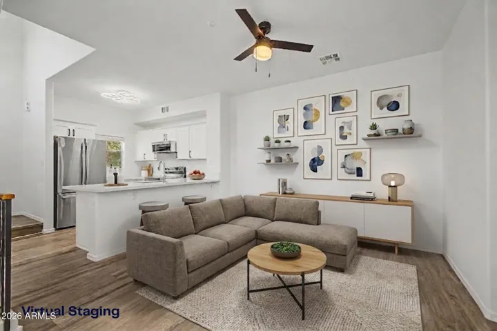 Great room with natural light and hard wood flooring