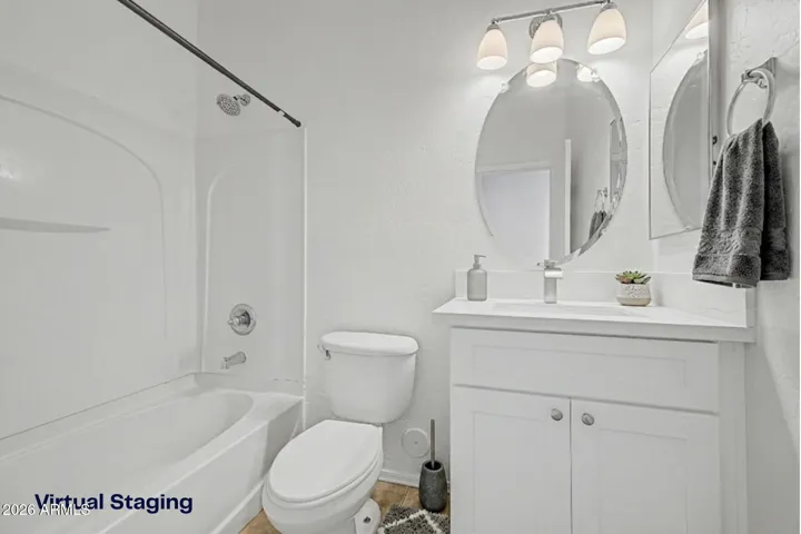 vanity mirror, multi light fixture, bathtub