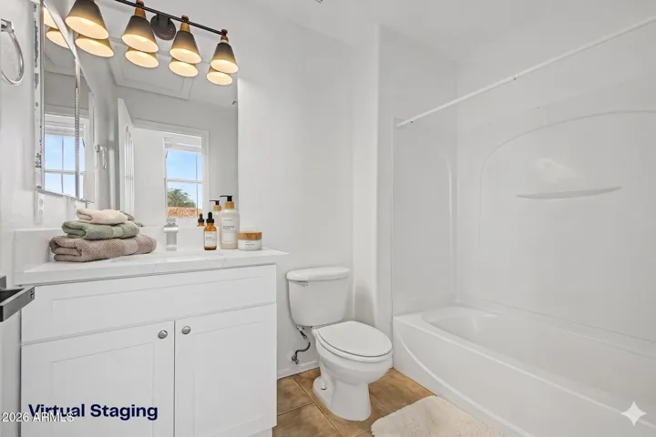 vanity mirror, multi light fixture, bathtub