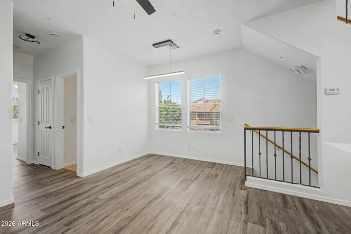 Great room with natural light and hard wood flooring