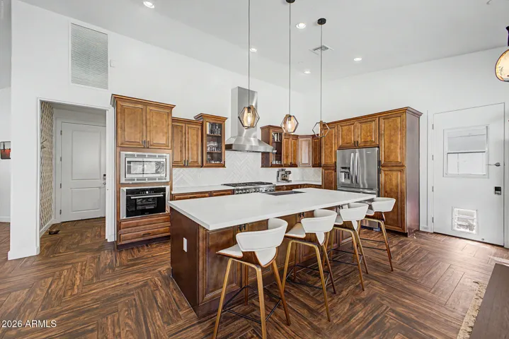 Large gourmet kitchen with island seating