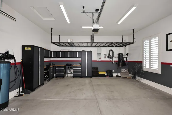 with added storage cabinets & racks, Tesla EV charger, direct access to home.