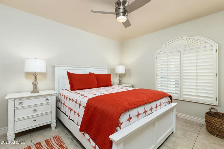 Guest Bedroom. Wood shutters. Ceiling Fan