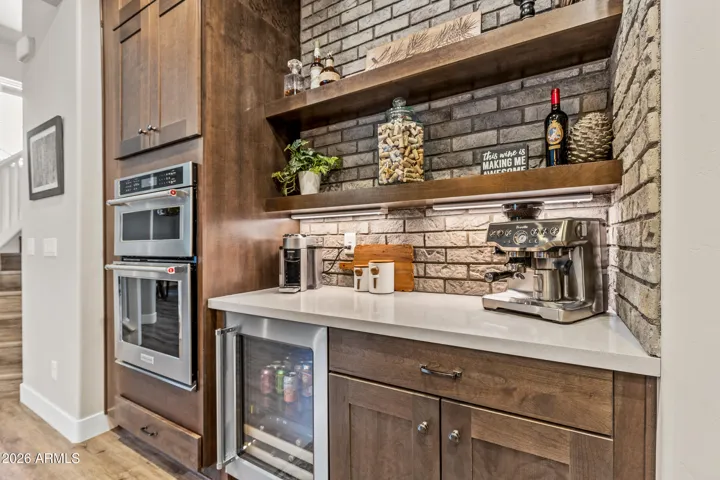 Enter into a stunning gourmet kitchen with large island for entertaining.
