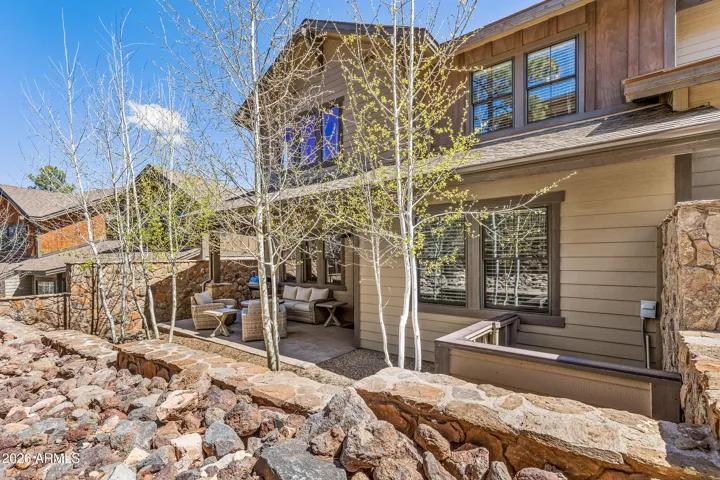 Lovely backyard enclosed with Malapais fence.