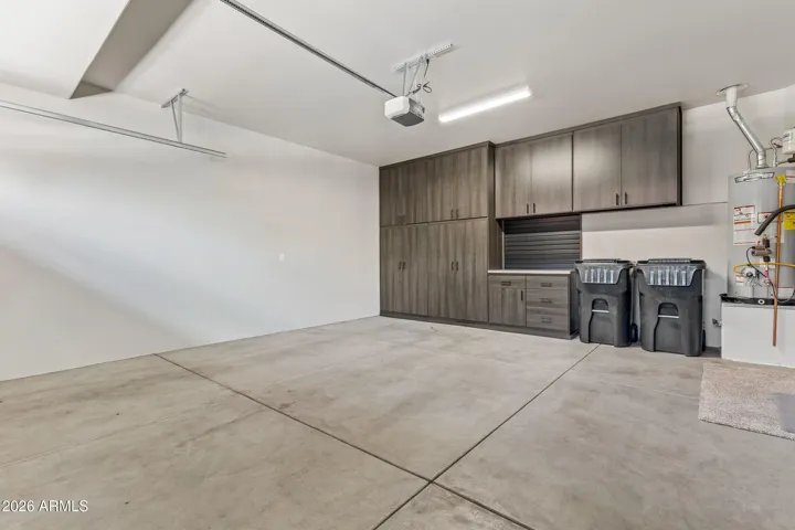 2-car garage with custom built-in cabinets.