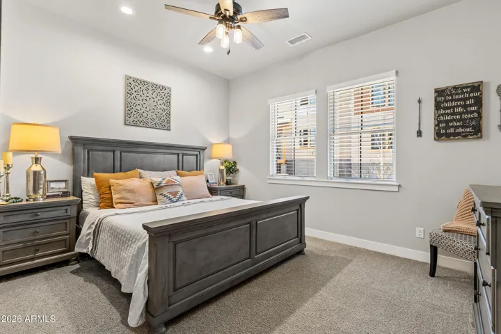 Private guest bedroom on top floor includes luxurious custom bed.