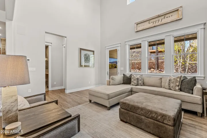 Great room on main floor leads to guest bedroom, bathroom and backyard.