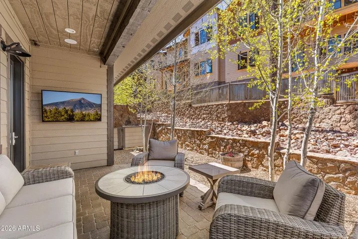 Relax and enjoy the mountain air around your fire table and tv.