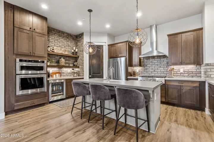 Enter into a stunning gourmet kitchen with large island for entertaining.
