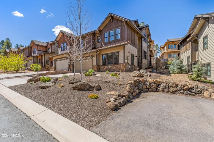 Front elevation of home that shows convenient extra guest parking only steps away.