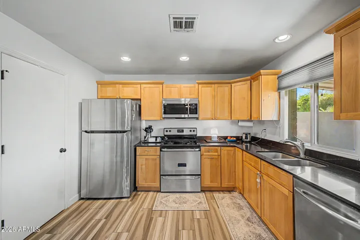 kitchen with stainless steel appliances (refrigerator stays)