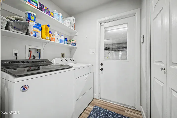 Laundry room with shelves and storage closet off kitchen and garage (w/d convey)