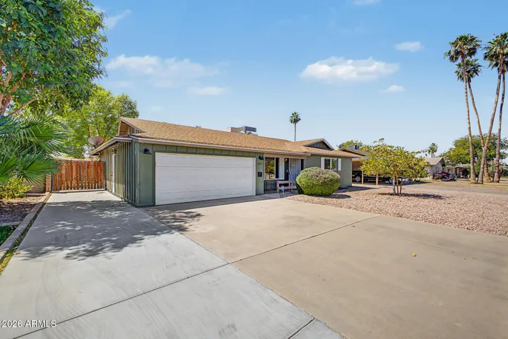 2-Car garage and extra pad for guest parking with RV gate