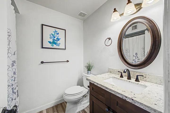 Full bath with granite vanity top