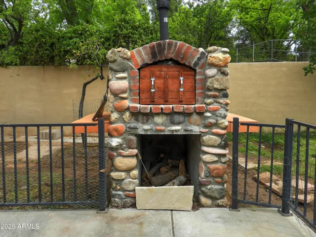 Wood burning stone pizza oven on back patio
