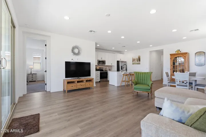 Light-filled living area flowing seamlessly into the kitchen and dining space.