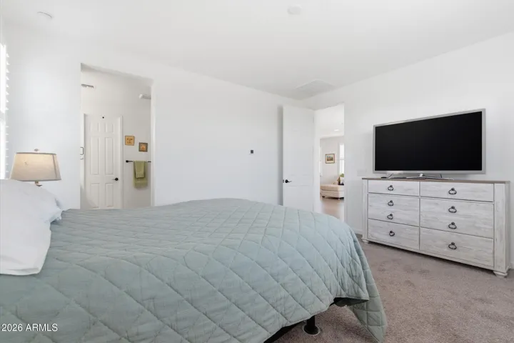 Spacious primary bedroom with easy access to en-suite bath.