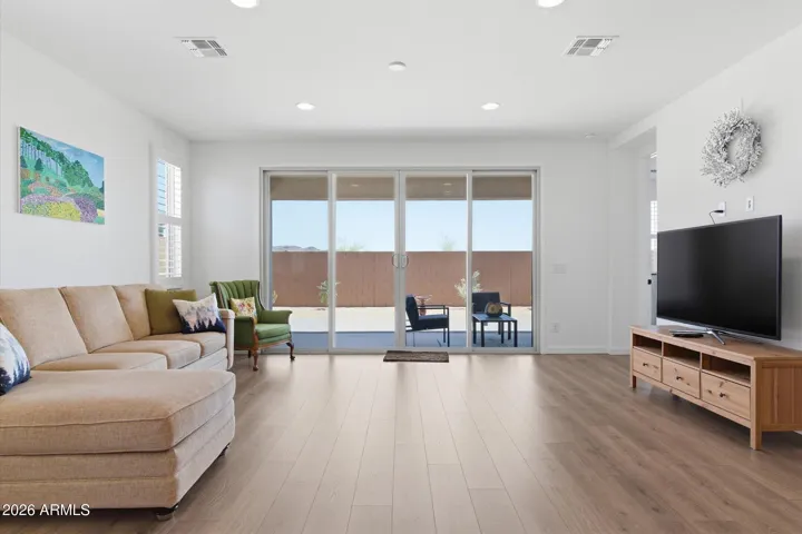 Great room with clear sightlines to kitchen and backyard.