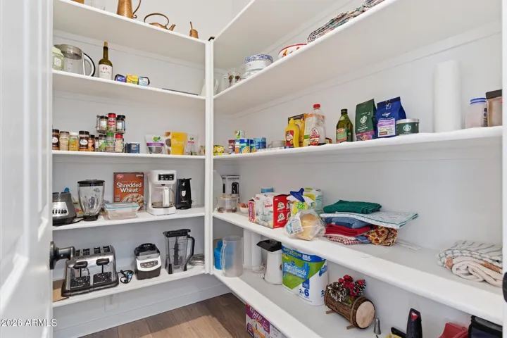 Walk-in pantry providing generous storage and organization.