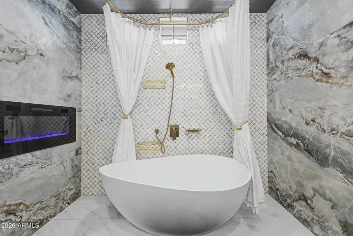 Designer soaking tub with custom fixtures