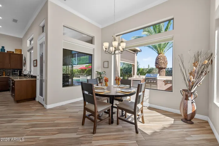 Enjoy a casual meal or cup of coffee while looking out over the resort style back yard.