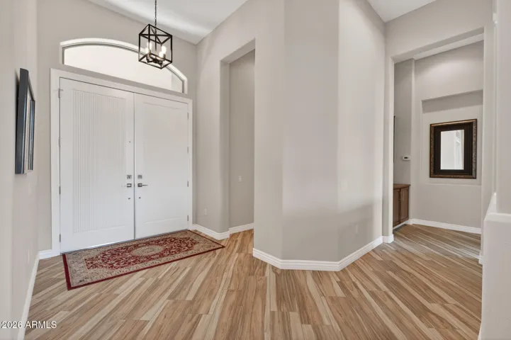 The guest suite entrance is to the right on this picture or step further inside to go to the hall leading to the owner's suite.
