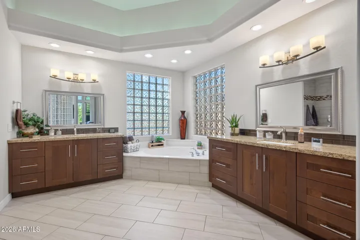 All cabinets, counters, lights and mirrors have been updated.
