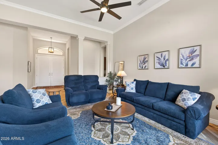 The owner's suite is located down the hall behind the living room couch wall.