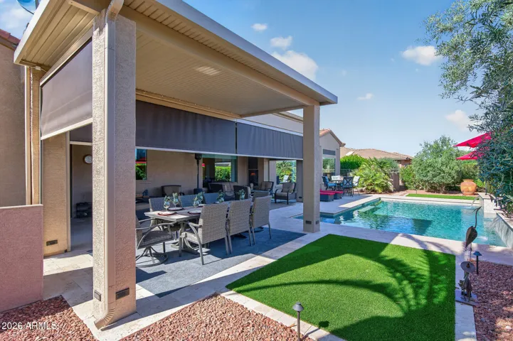 Enjoy a casual outdoor meal under the extended patio cover w/remote sunscreens.