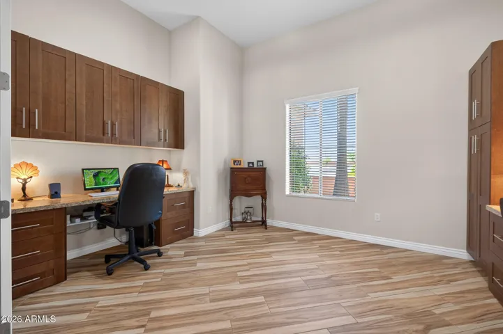 This large den offers 2 built-in desks...one on each side of the room. Yet leaves space for a bed too.